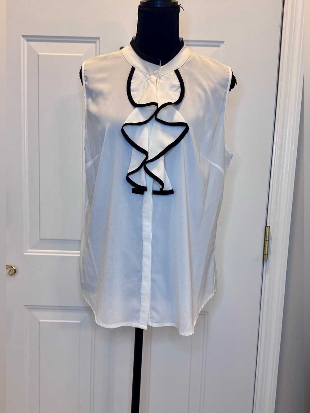 Sleeveless White Ruffle Front Top with Black Trim